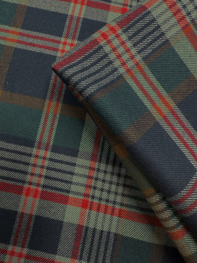 A close-up of Super Cheap Fabrics’ Flannel Tartan - Glenmore Forest - 145cm highlights its lightweight cotton flannel in a heritage pattern with dark green, navy blue, red, and beige intersecting lines.