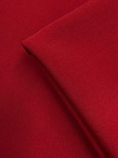 Close-up of two overlapping pieces of Liquid Twill - Rythmic Red (150cm) from Super Cheap Fabrics, highlighting the smooth texture, fine weave, and subtle folds.
