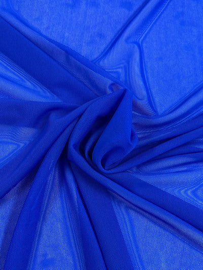 A close-up of Super Cheap Fabrics' Plain Mesh - Dazzling Blue (155cm) shows vivid blue polyester with a mesh-like texture, gently gathered into folds. It's lightweight and semi-sheer, ideal for clothing or decor.
