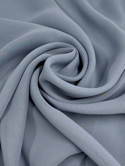 Super Cheap Fabrics’ Hi-Multi Chiffon - Blue Fog (148cm) is a soft, lightweight fabric with a smooth, subtly textured surface and elegant drape—ideal for crafting floaty tops.