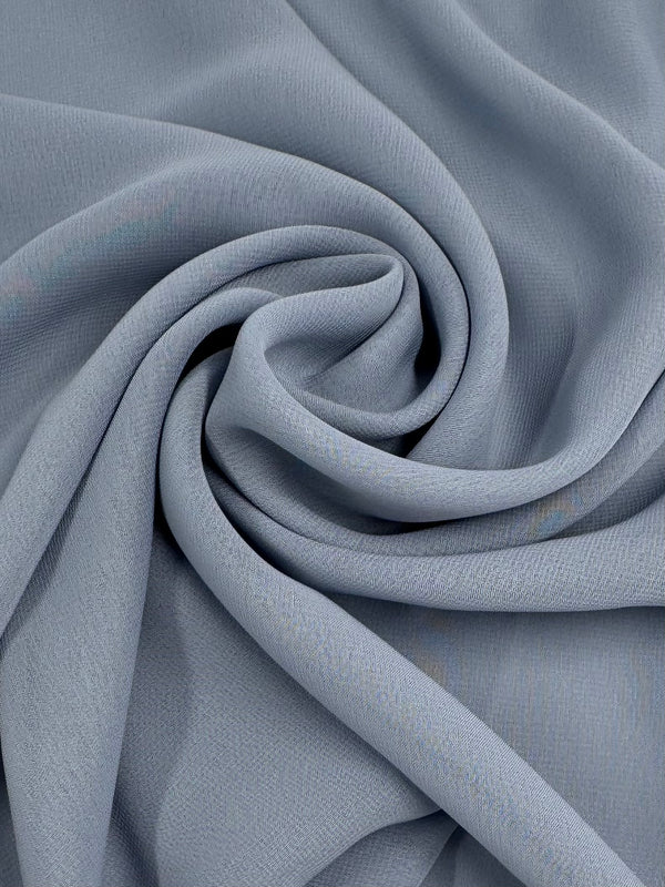 Super Cheap Fabrics’ Hi-Multi Chiffon - Blue Fog (148cm) is a soft, lightweight fabric with a smooth, subtly textured surface and elegant drape—ideal for crafting floaty tops.