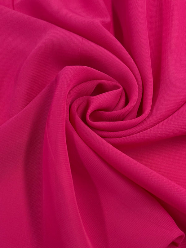 Hi-Multi Chiffon - Hot Pink (148cm) by Super Cheap Fabrics features bright, sheer fabric with a soft texture and gentle folds, ideal for floaty tops.