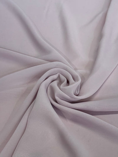 Super Cheap Fabrics' Hi-Multi Chiffon in Keepsake Lilac (148cm) features a soft, lightweight, and slightly sheer fabric with gentle folds and a smooth, subtly textured appearance under light.