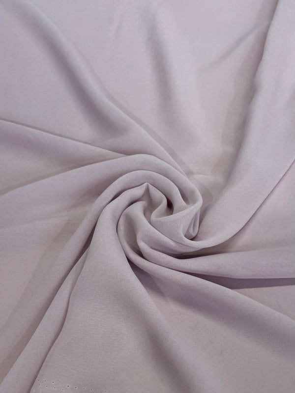 Super Cheap Fabrics' Hi-Multi Chiffon in Keepsake Lilac (148cm) features a soft, lightweight, and slightly sheer fabric with gentle folds and a smooth, subtly textured appearance under light.