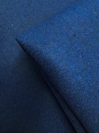 A close-up of Super Cheap Fabrics' Melton Wool - Blue Quartz (150cm), showing its textured, soft, and slightly fuzzy surface—ideal as a heavyweight wool fabric for outerwear.