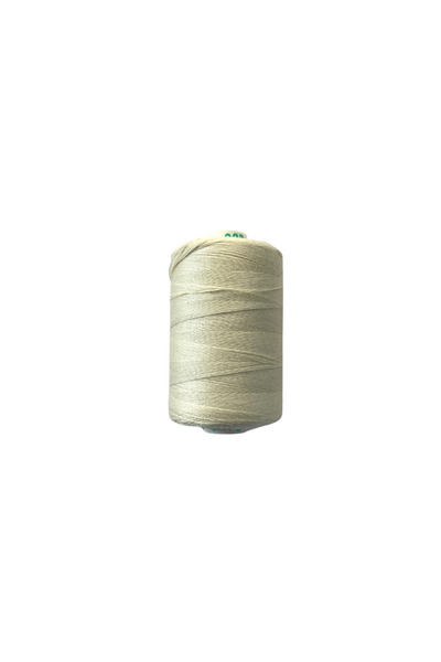 A spool of Super Cheap Fabrics Thread - Natural, spun polyester in light beige, 1000 meters long, stands upright against a white background.